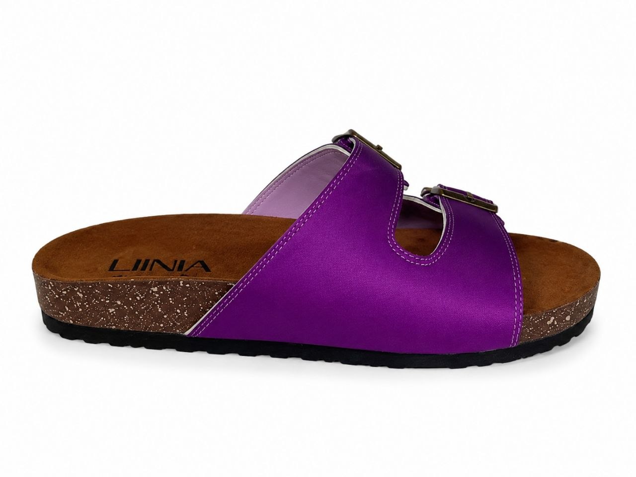 A single purple double-strap slide sandal with a cork-look midsole and black outsole, shown from the side on a white background. The brand name 'UINIA' is printed on the footbed.